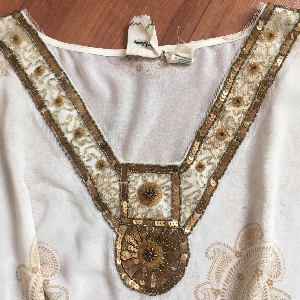 Nurture tunic top with sequenced decor